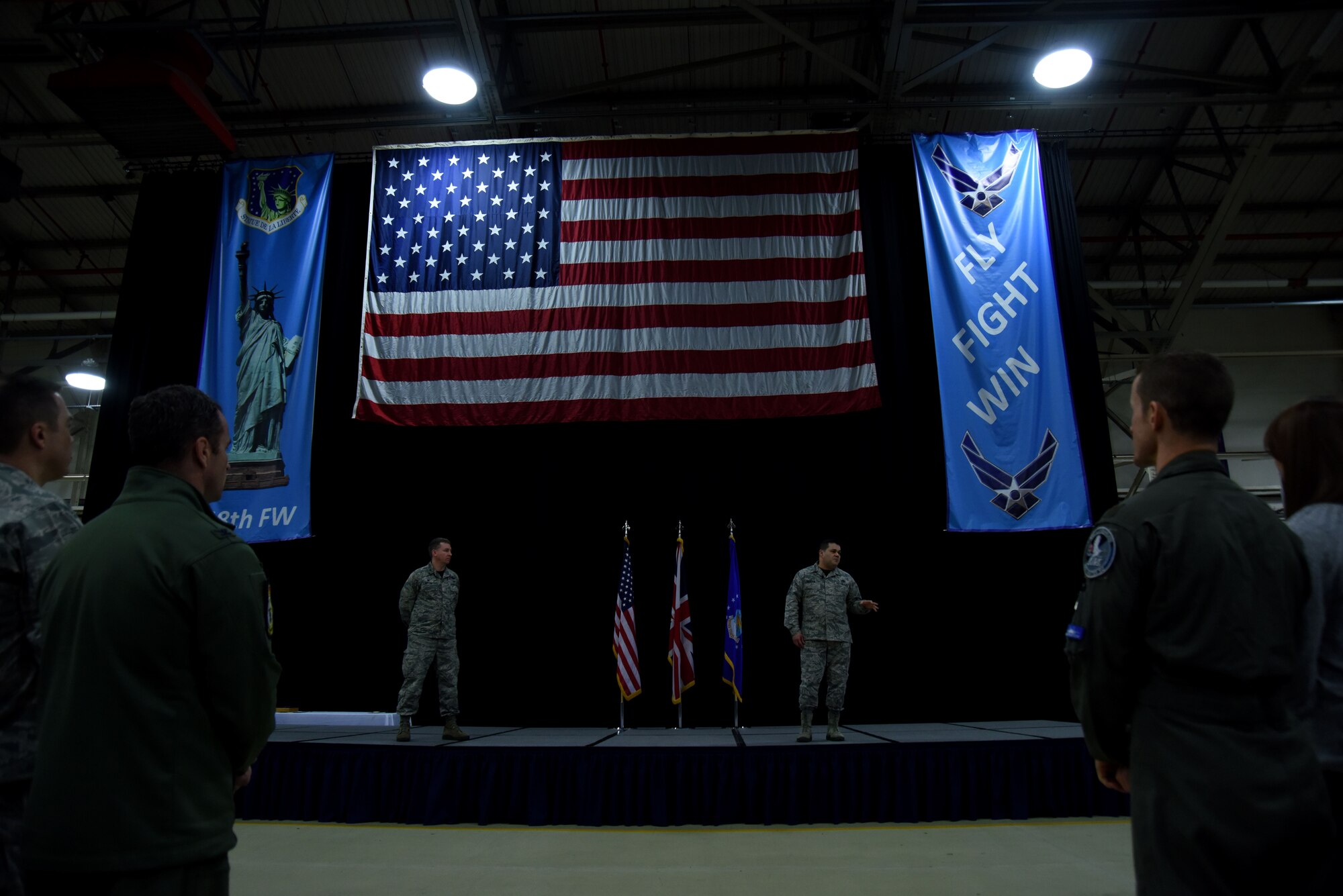 U.S. Air Force Chief Master Sgt. Ernesto J. Rendon, right, 48th Fighter Wing command chief master sergeant, addresses Airmen during a wing all-call at Royal Air Force Lakenheath, England, Jan. 12. During the all-call, the command chief provided updates on Quality of Life initiatives for the base’s Airmen and families. (U.S. Air Force photo/Senior Airman Abby L. Finkel)