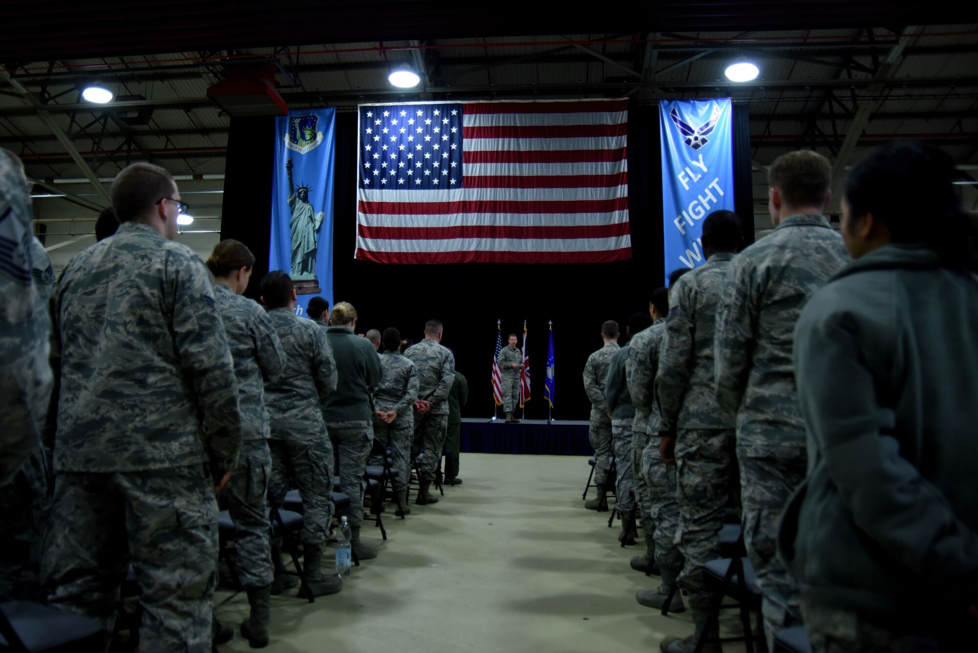 U.S. Air Force Col. Evan Pettus, 48th Fighter Wing commander, speaks to Liberty Wing Airmen during a wing all-call at Royal Air Force Lakenheath, England, Jan. 12. During the all-call, the commander reflected on the wing’s accomplishments in 2017. (U.S. Air Force photo/Senior Airman Abby L. Finkel)