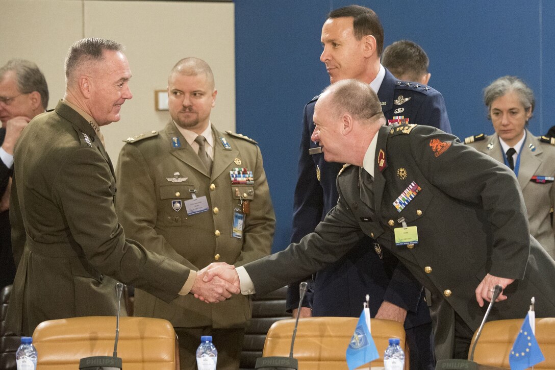 Marine Corps Gen. Joe Dunford shakes hands with one of his European counterparts.