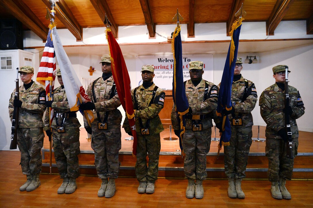 Bagram honor guard present the colors at the Enduring Faith Chapel to celebrate Martin Luther King Day.