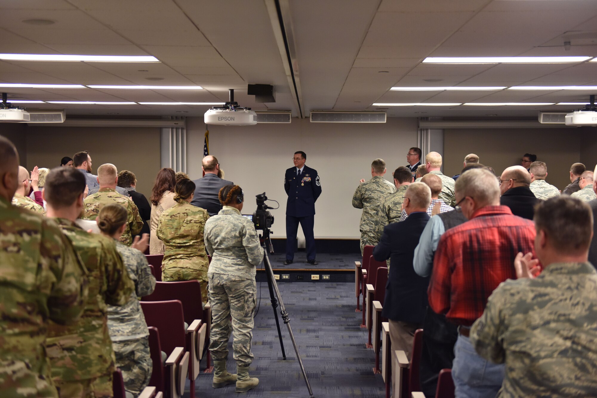 Chief Master Sgt. Bruce Bair receives a standing ovation from attendees during his retirement ceremony at the Pittsburgh International Airport Air Reserve Station, Jan. 6, 2018. Bair is the last flight engineer to retire from the 911th Airlift Wing, departing the military after 38 years of faithful service. (U.S. Air Force photo by Staff Sgt. Marjorie A. Bowlden)