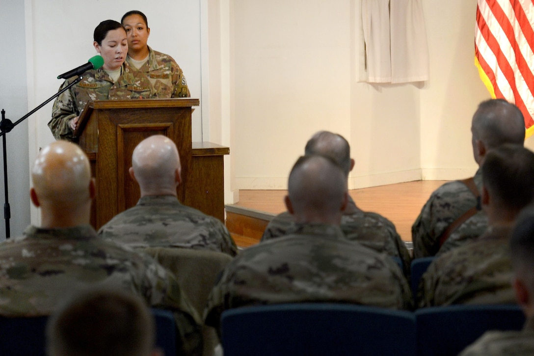 An airman delivers a speech to service members gathered at the Enduring Faith Chapel to celebrate Martin Luther King Day.