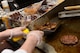 Steak tips sizzle as Airman 1st Class Albert Homa, a food services apprentice assigned to the 28th Force Support Squadron, grills inside the Raider Café at Ellsworth Air Force Base, S.D., Jan. 11, 2018.