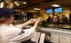 Airman 1st Class Albert Homa, a food services apprentice assigned to the 28th Force Support Squadron, serves a customer inside the Raider Café at Ellsworth Air Force Base, S.D., Jan. 11, 2018.