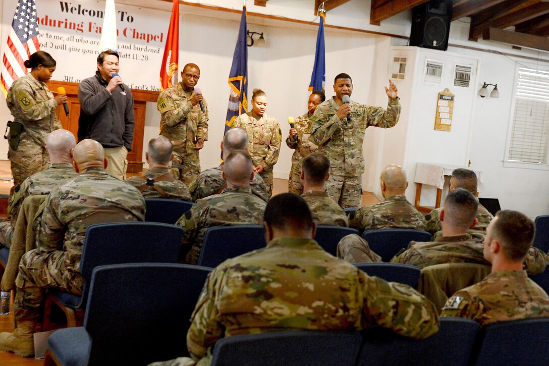 Service members sing to troops at the Enduring Faith Chapel to celebrate Martin Luther King Day.