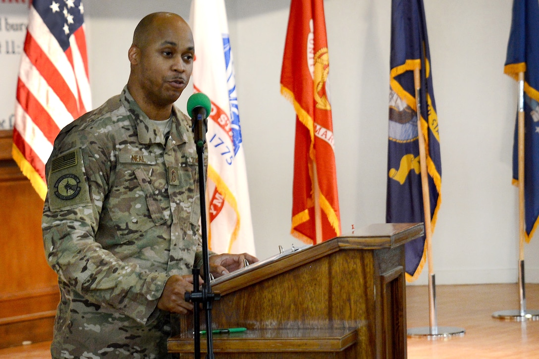 An airman delivers a speech to service members gathered at the Enduring Faith Chapel to celebrate Martin Luther King Day.