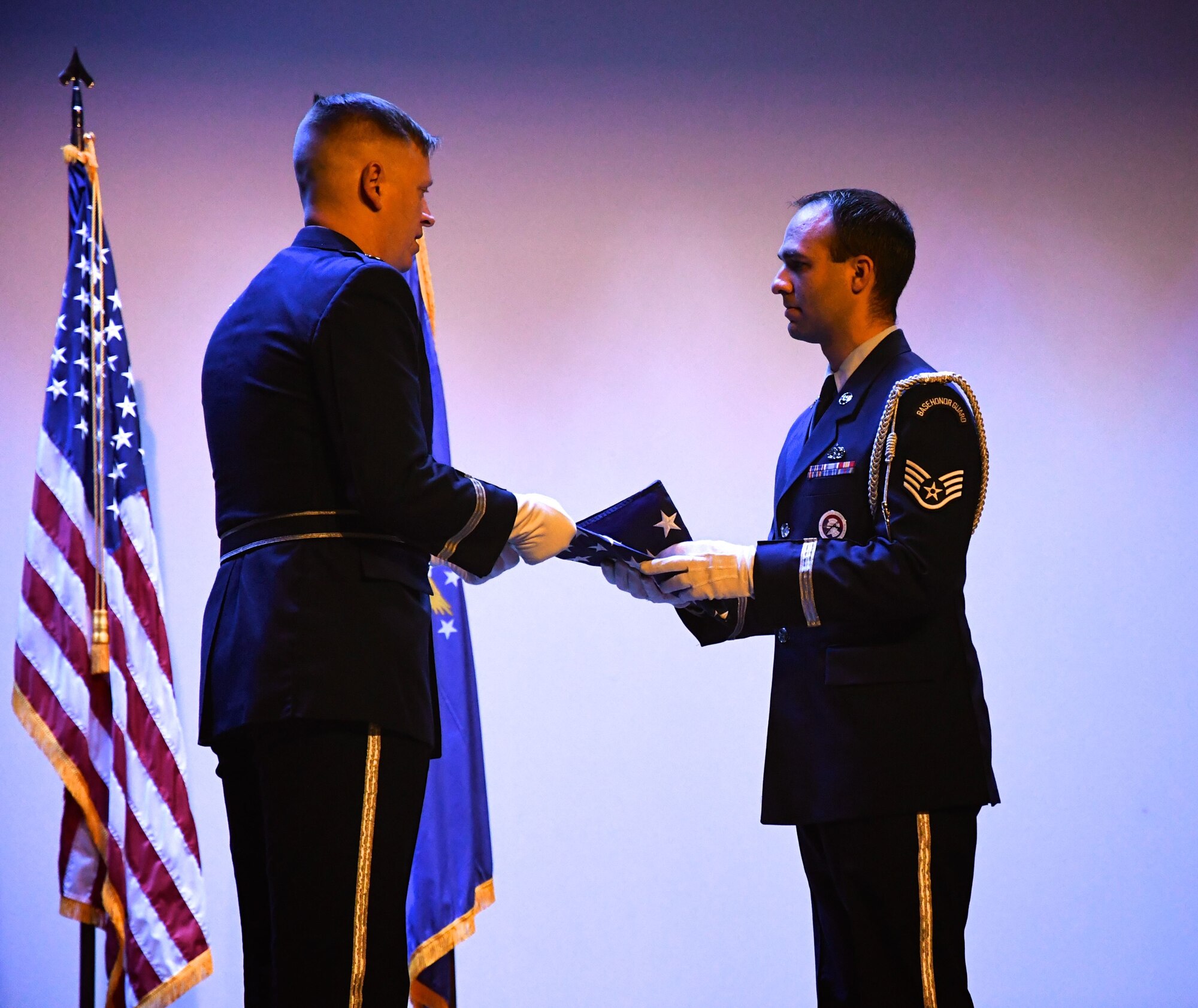 The 932nd Airlift Wing Honor Guard carefully folds and prepares the United States flag for presentation at a recent retirement on behalf of the outgoing commander of the 932nd Aeromedical Staging Squadron, Col. Diane Doty.  Her last official ceremony took place Jan. 6, 2018, at Scott Air Force Base, Ill. Family and friends came from near and far, paying their respects to her 30 plus years of military service to the nation.  (U.S. Air Force photo by Lt. Col. Stan Paregien)