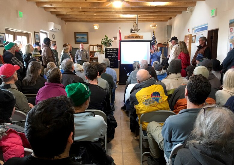 Volunteers for Abiquiu Lake's annual Midwinter Eagle Watch listen to an introductory presentation from The Wildlife Center's representatives, Jan. 6, 2018, before heading out to the lake to count eagles.