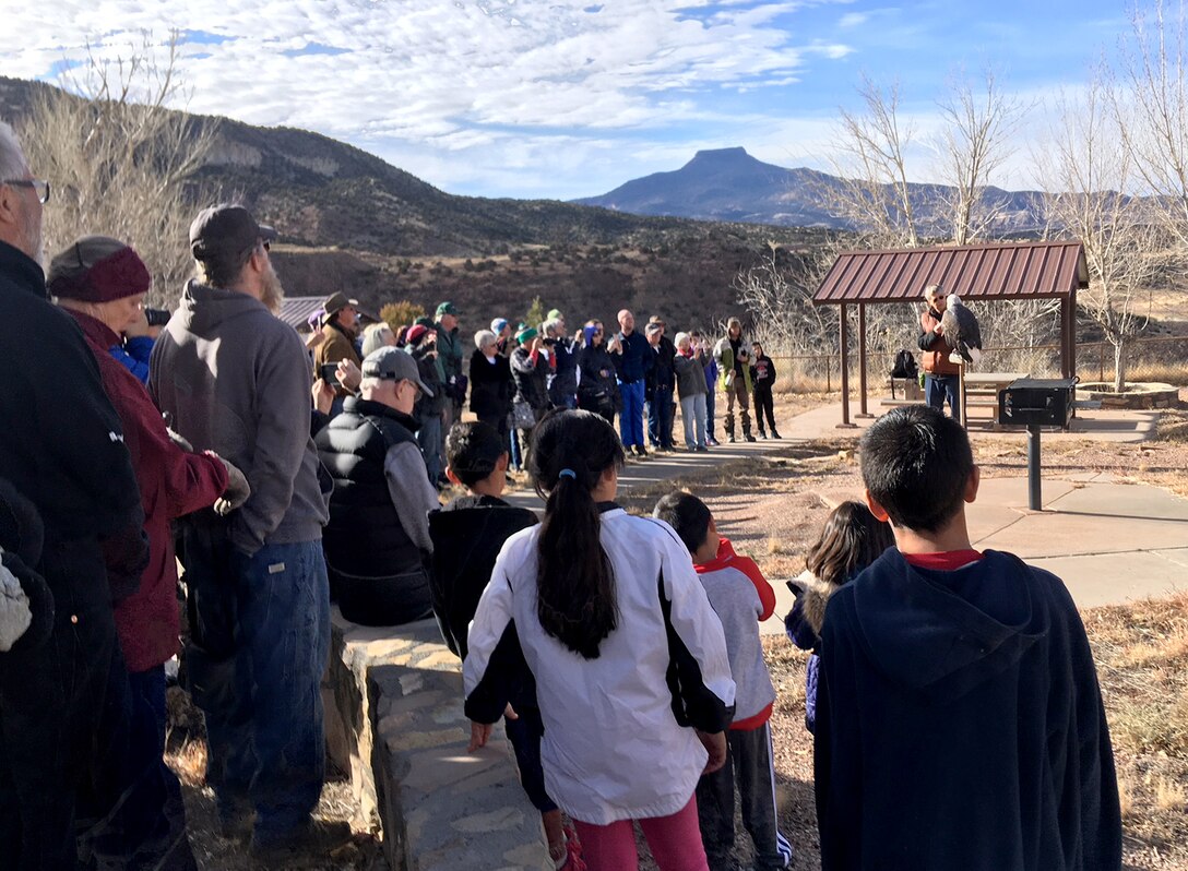 Volunteers for Abiquiu Lake's annual Midwinter Eagle Watch listen to an introductory presentation from The Wildlife Center's representatives, Jan. 6, 2018, before heading out to the lake to count eagles. The Wildlife Center presented their captive bald eagle Maxwell to the group to highlight some of the distinguishing characteristics between golden eagles, and mature and immature bald eagles.