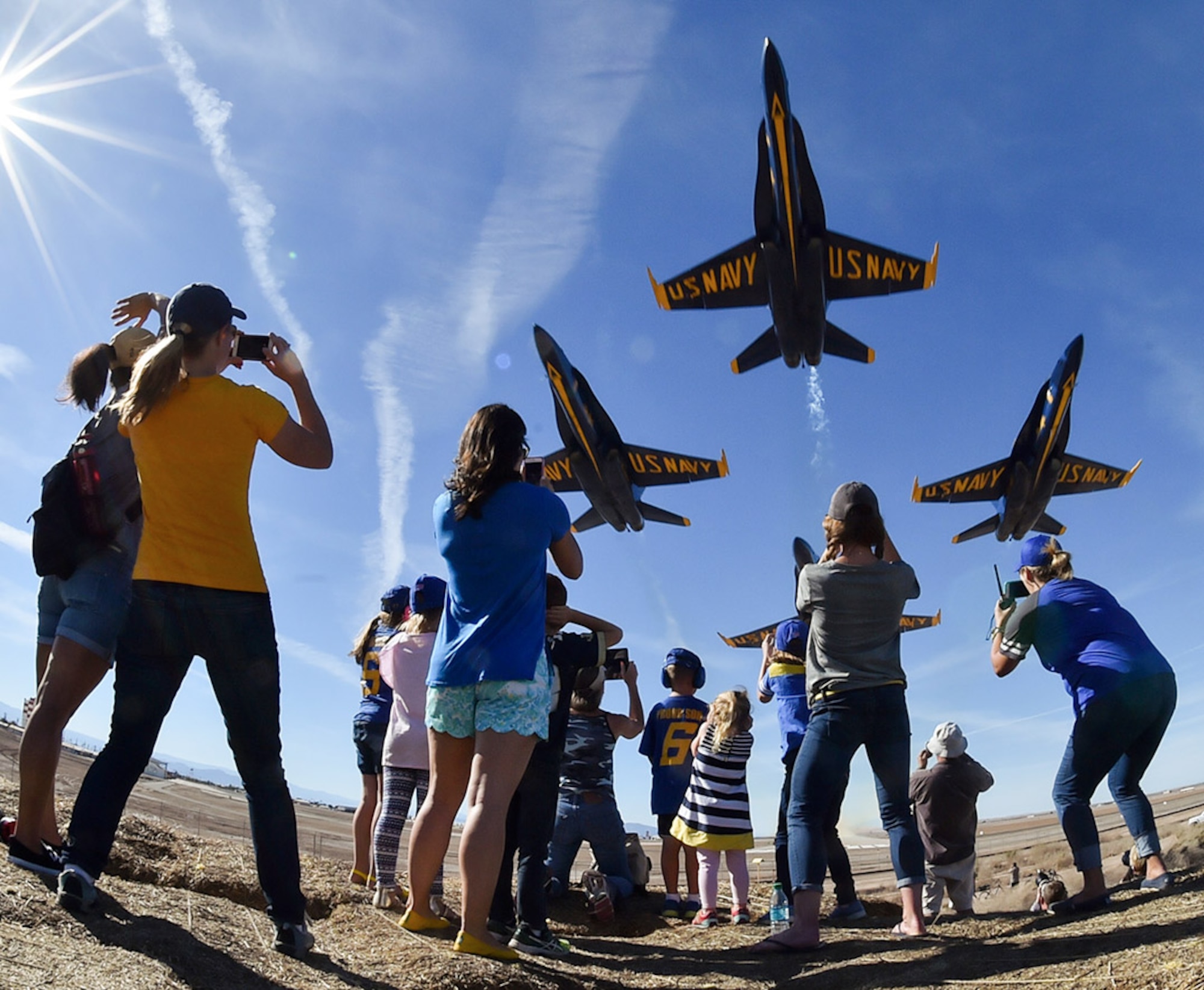 U.S. Navy Blue Angels fly over an excited crowd during a recent airshow.  The Blue Angels are the Navy's premiere aerial demonstration team and perform at air shows around the world.