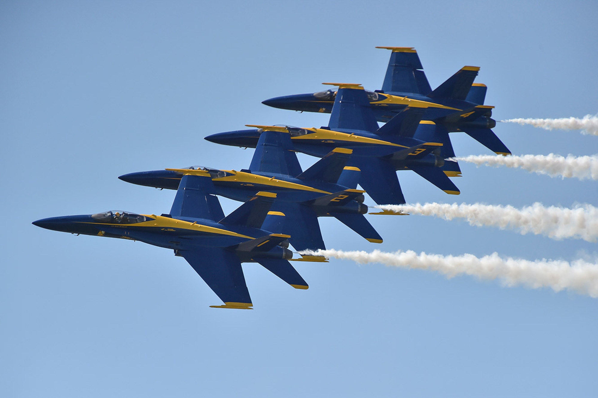 U.S. Navy Blue Angels fly over an excited crowd during a recent airshow.  The Blue Angels are the Navy's premiere aerial demonstration team and perform at air shows around the world.