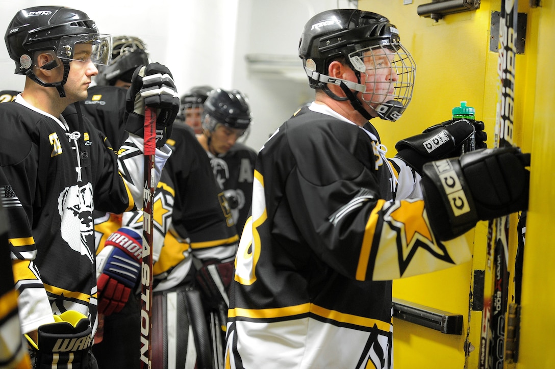 Soldiers prepared in their locker room before competing in the 5th Annual Army vs. Air Force Hockey Game.
