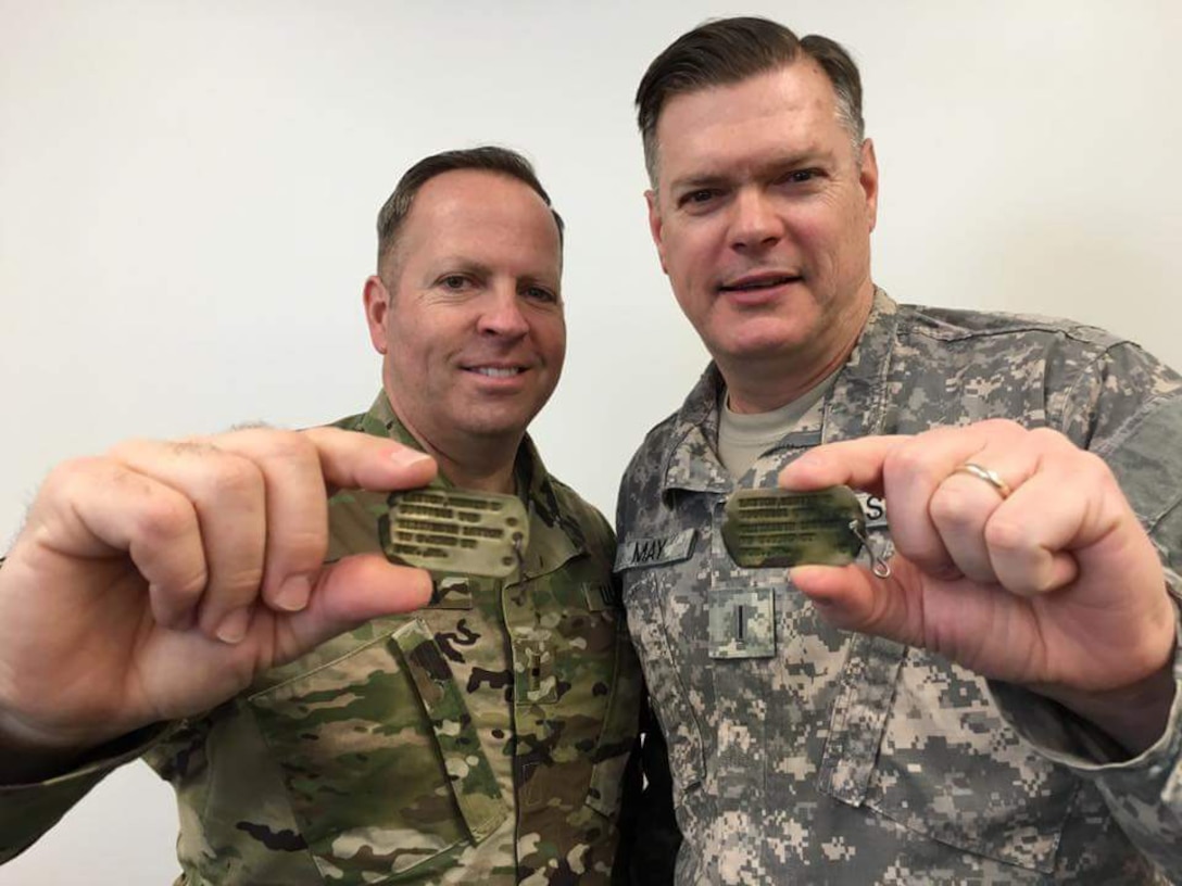 U.S. Army Chief Warrant Officer 2 Nathaniel Layton, 97th Transportation Company, 7th Transportation Brigade (Expeditionary) chief engineer, and Chief Warrant Officer 5 Patrick May, Office of the Chief of Transportation chief maritime qualification director, only met once growing up, today they are closer than ever and owe this to the Army.