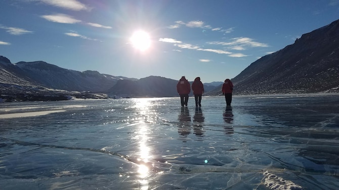 Airmen from the Air Force Technical Applications Center, Patrick AFB, Fla., walk on a frozen lake in Antarctica after a full day of performing maintenance on the center’s seismic equipment near Bull Pass.  The photo, taken at about 10 p.m., illustrates the 24-hour daylight cycle at Earth’s southernmost point.  Pictured from left to right:  Staff. Sgt. Jeremy Hannah, Senior Airman Andrew Pouncy and Staff Sgt. Justin Sherman.  (U.S. Air Force photo by Senior Airman Richard Westra)