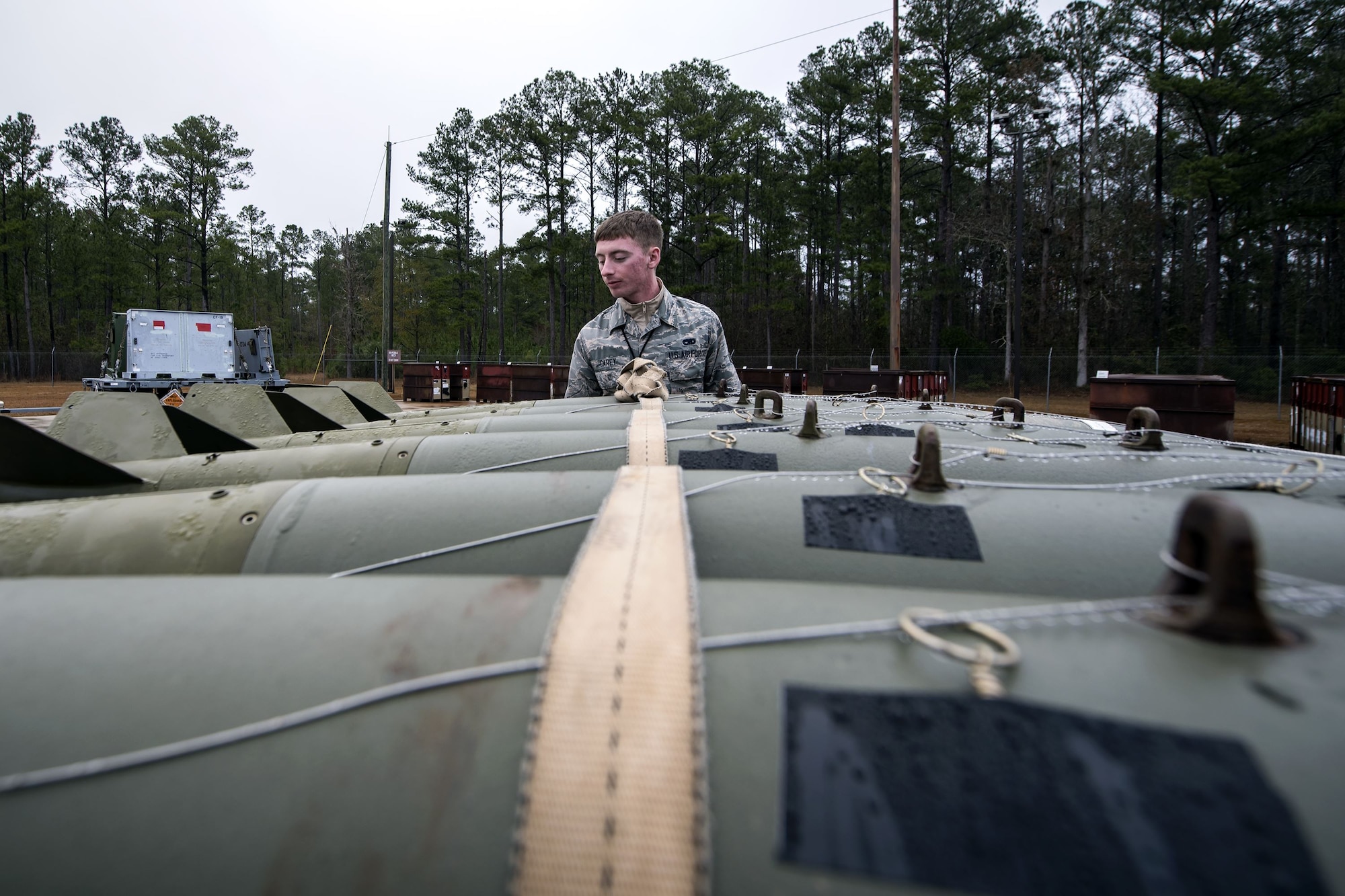 Airman 1st Class Colten Carey, 23d Maintenance Squadron (MXS) precision guided munitions technician, examines Joint Direct Attack Munitions, Jan. 11, 2018, at Moody Air Force Base, Ga. The 23d MXS held a combat munitions class to help acclimate and improve their Airmen’s readiness to perform well in a deployed environment.  (U.S. Air Force photo by Airman Eugene Oliver)