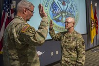 Col. Scott Grammer recites the oath of commission to Maj. Gen. Richard Gallant, commander, Joint Task Force Civil Support, during his promotion ceremony to Colonel , January 11, 2017.