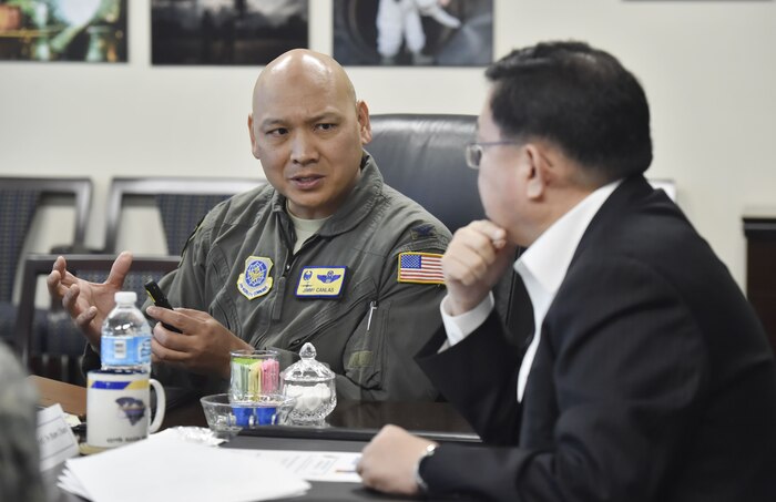 Col. Jimmy Canlas, 437th Airlift Wing commander, briefs retired Republic of Korea army Lt. Gen. In-Bum Chun on the 437th AW mission during a visit here Jan. 16. Chun also learned about the 437th Airlift Wing mission and shared his U.S. and ROK alliance perspective with U.S. service members during the visit.
