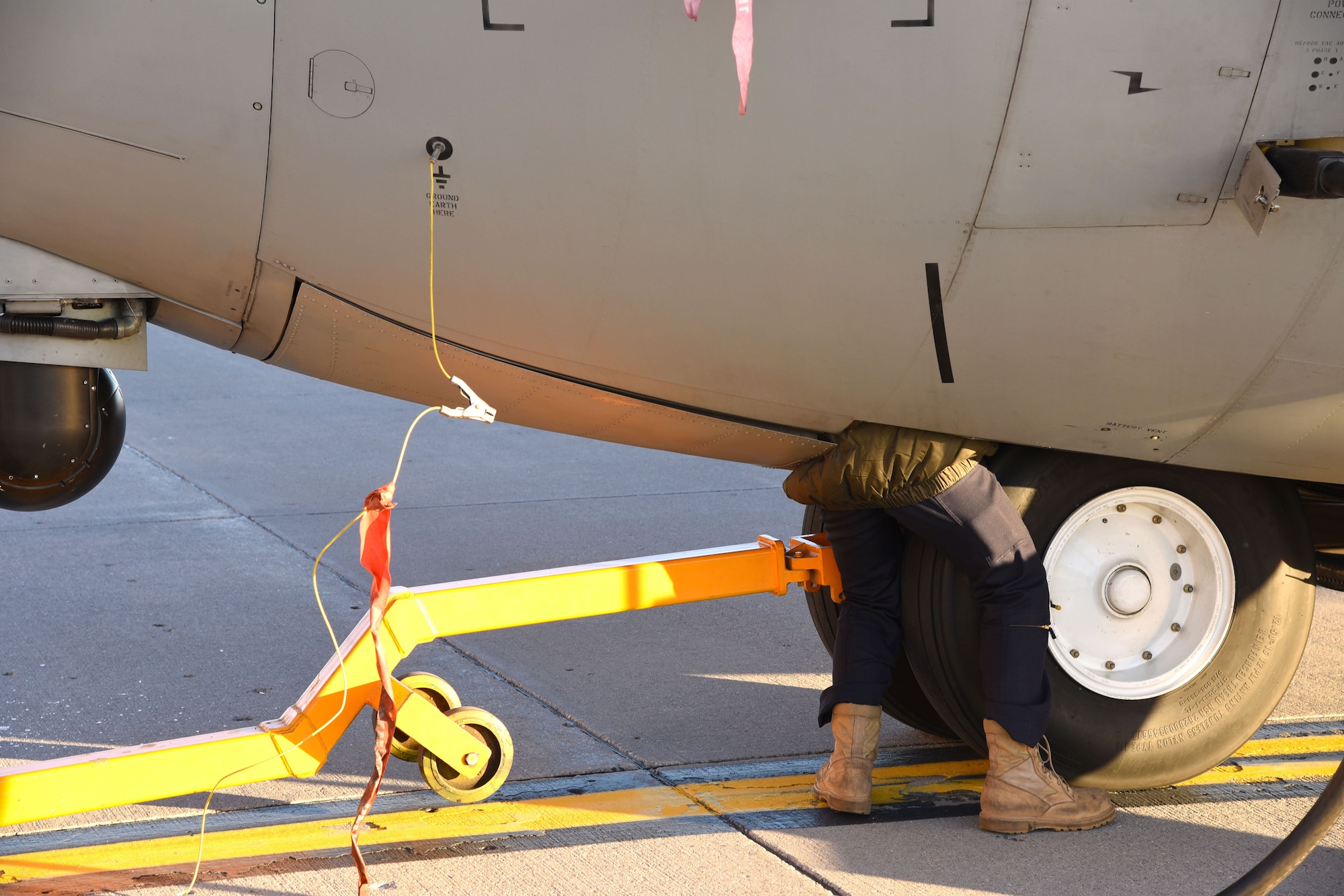 A service member with the Indian Air Force performs routine maintenance on a C-130 Hercules during a pit-stop at Grand Forks Air Force Base, N.D. Jan. 13, 2018, before heading to McChord AFB, Wash. for exercise Vajra Prahar. (U.S. Air Force photo by Airman 1st Class Elora J. Martinez)