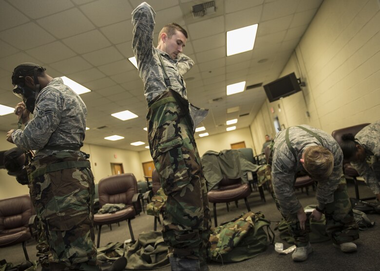 Airmen assigned to Altus Air Force Base, Okla., practice donning Mission Oriented Protective Posture (MOPP) gear, Jan. 10, 2018, at Altus AFB.