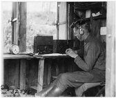 A soldier mans a field intercept station.  These stations collected coded encrypted messages of enemy ground units.