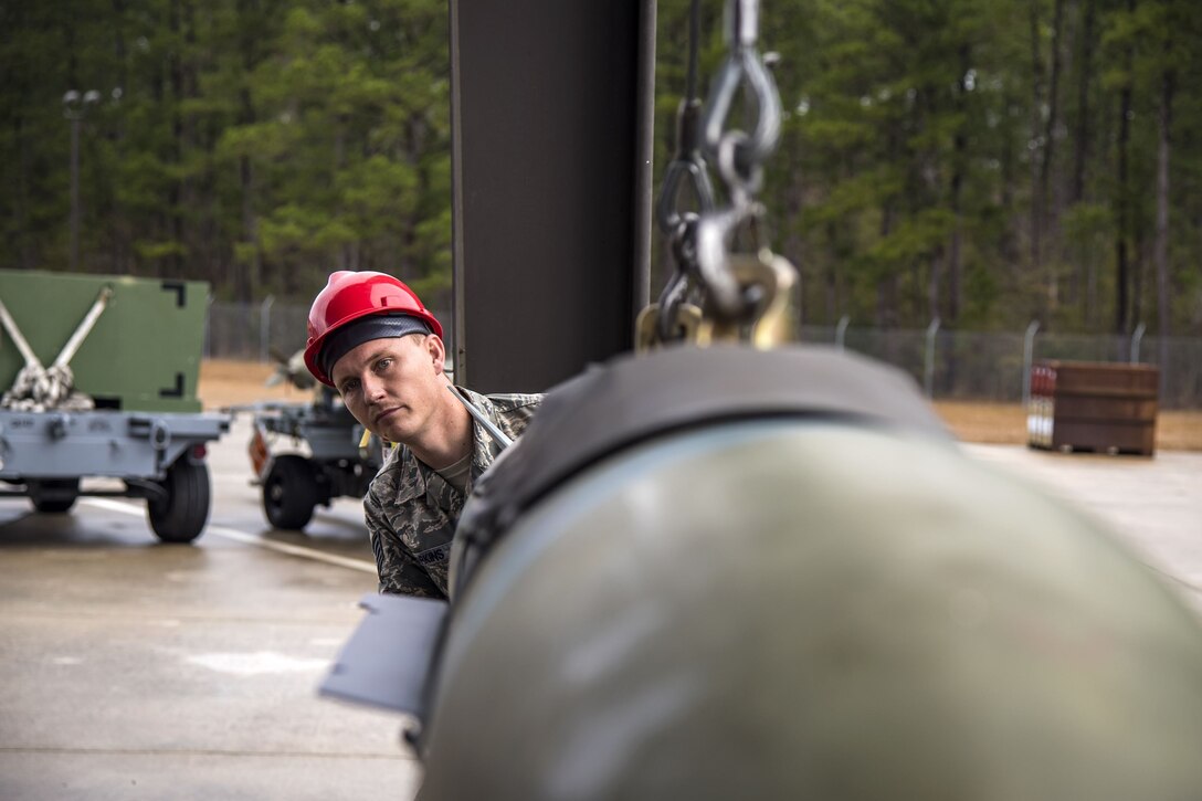 Staff Sgt. Clinton Parkins, 23d Maintenance Squadron (MXS) line delivery supervisor, inspects the alignment of a Joint Direct Attack Munition, Jan. 11, 2018, at Moody Air Force Base, Ga. The 23d MXS held a combat munitions class to help acclimate and improve their Airmen’s readiness to perform well in a deployed environment. (U.S. Air Force photo by Airman Eugene Oliver)