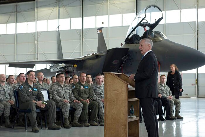 The defense secretary holds a town hall meeting at an air force base.