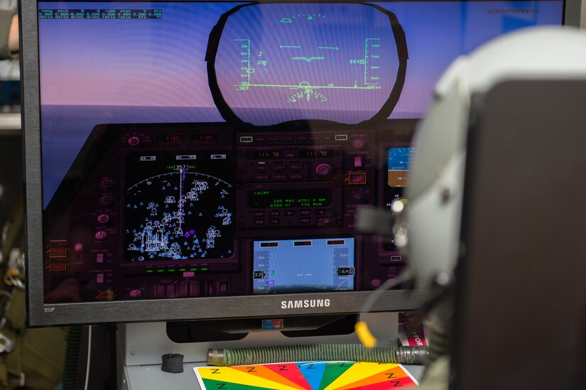 U.S. Air Force Lt Col Samuel Mcintyre, NATO Allied Command Transformation deputy chief of staff military assistant, pilots a flight simulator while taking hypoxia training at 1st Operations Group aerospace and operational physiology, Joint Base Langley-Eustis, Va., Dec. 5, 2017. Some symptoms of hypoxia may include tingling in extremities, affected vision, nausea, light headedness, euphoria and/or belligerency. (U.S. Air Force photo by Airman 1st Class Tristan Biese)