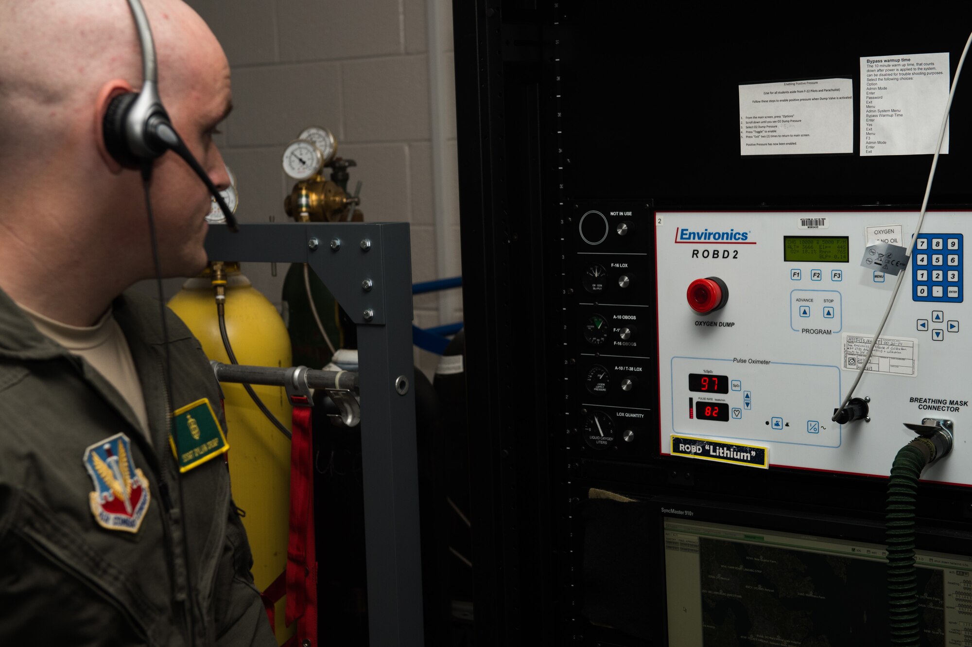 U.S. Air Force Staff Sgt. Dylan Crump, 1st Operations Group aerospace and operational physiology technician, watches vitals on the Reduced Oxygen Breathing Device at 1st OG AOP, Joint Base Langley-Eustis, Va., Dec. 5, 2017. The ROBD is a machine that is used to simulate high altitude exposure environments to induce hypoxia symptoms so that the individuals practice recognizing the symptoms. (U.S. Air Force photo by Airman 1st Class Tristan Biese)