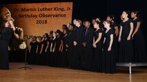 The Woodside High School Choir performs a musical piece in honor of Dr. Martin Luther King, Jr. at Fort Eustis’ Wylie Theater during a celebration at Joint Base Langley-Eustis, Va., Jan. 11, 2018.
