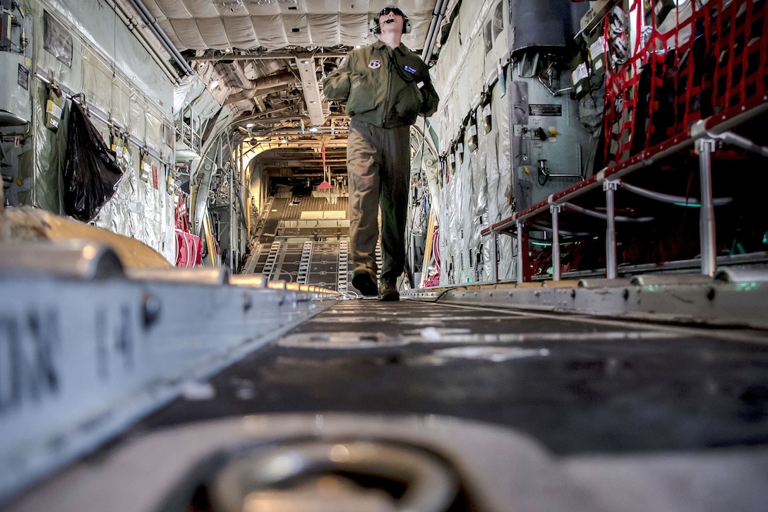 Tech. Sgt. Chris Brandal performs pre-flight inspections inside a C-130H Hercules aircraft.