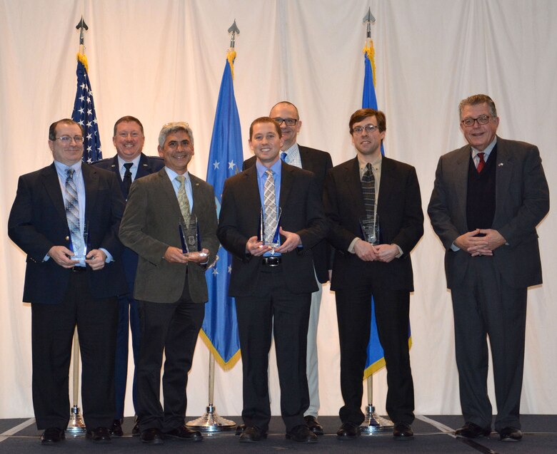 Michael Cleary presented the directorate’s most prestigious award, the Charles J. Cleary Scientific Achievement Award, to the Flexible Gallium Nitride for High Performance, Strainable Radio Frequency Devices Team at the 65th Annual Materials and Manufacturing Directorate Awards Luncheon. Shown left to right Dr. Donald Dorsey, Col. Charles Ormsby, Dr. Benji Maruyama, Dr. Nicholas Glavin, Dr. Timothy Bunning, Dr. Eric Heller and Michael Cleary.