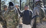 Afghan National Defense Security Forces role players talk to Capt. Justin Alexander, a combat team advisor team leader assigned to the 1st Security Force Assistance Brigade during a simulated event at the Joint Readiness Training Center at Fort Polk, La., Jan. 13, 2018. The JRTC rotation was conducted in order to prepare the newly formed 1st SFAB for an upcoming deployment to Afghanistan in spring of 2018. SFAB’s provide combat advising capability while enabling brigade combat teams to prepare for decisive action, improving readiness of the Army and its partners. (U.S. Army photo by Pfc. Zoe Garbarino/Released)