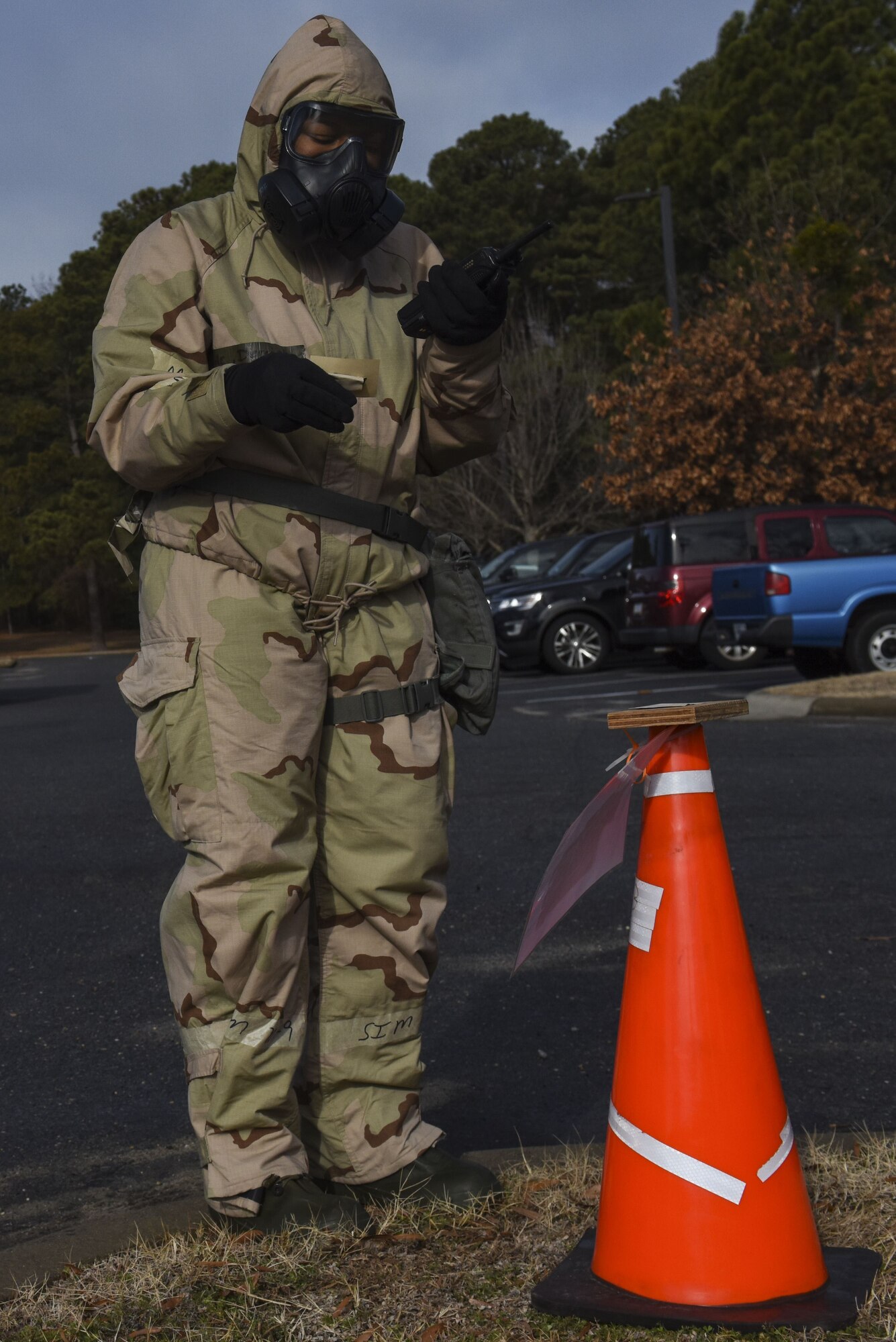 Staff Sgt. Mary McKnight, 916th Civil Engineer Squadron emergency management technician, inspects and reports the findings of a chemical agent detection paper station during exercise Thunderdome 18-01, Jan. 11, 2018, at Seymour Johnson Air Force Base, North Carolina. As a member of the post-attack reconnaissance team, McKnight checked several stations after a simulated attack to see if the areas were contaminated. (U.S. Air Force photo by Staff Sgt. Brittain Crolley)