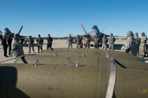 U.S. Air Force Chief Master Sgt. Christopher Shaver, 1st Maintenance Group wing weapons manager, opens the 4th Quarter Weapons Load Competition with introductions of the load crew at Joint Base Langley-Eustis, Va., Jan. 2, 2018. Three crews were selected from the 1st AMXS and 94th Aircraft Maintenance Unit to compete for the best load crew of the 4th quarter. (U.S. Air Force photo by Senior Airman Derek Seifert)