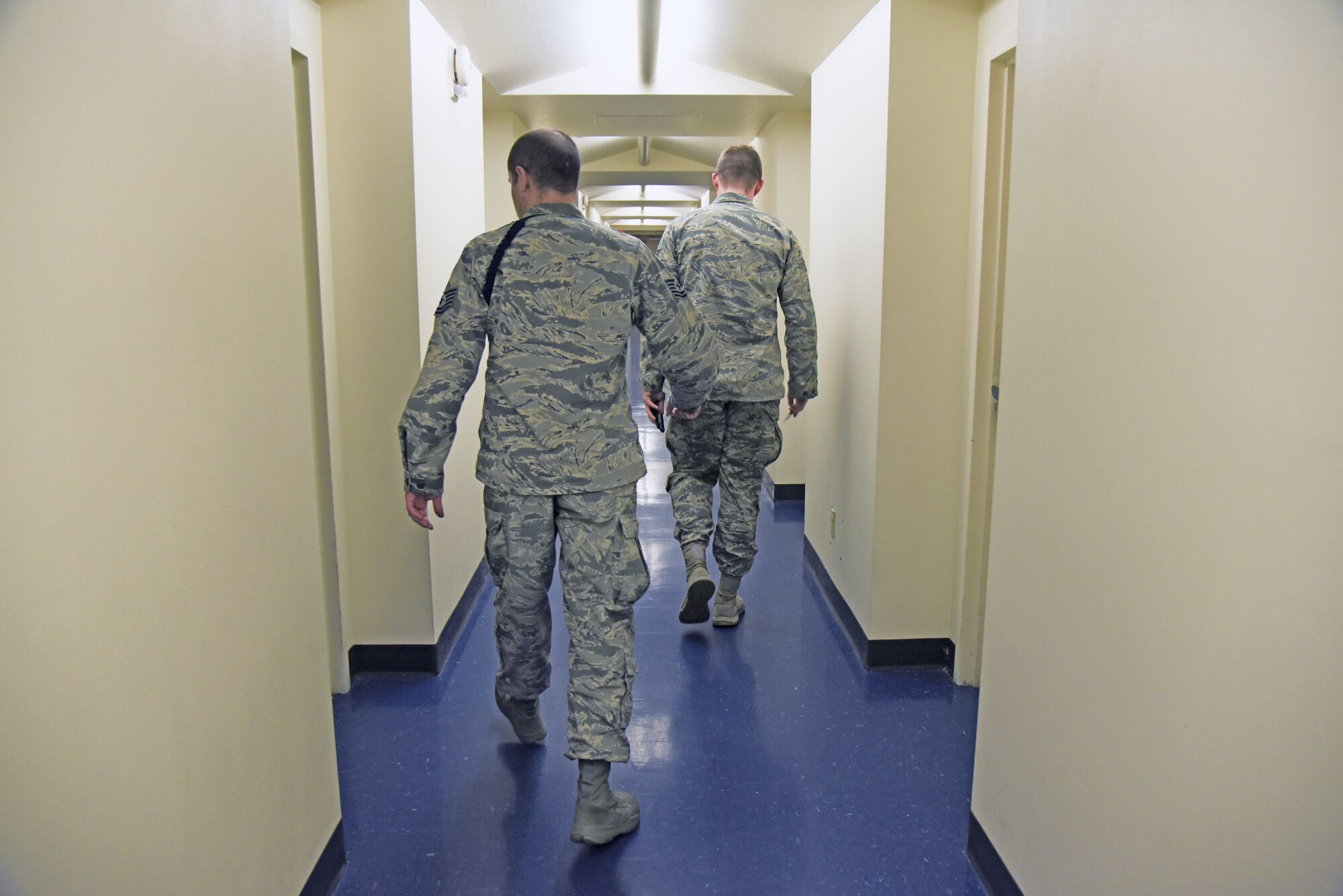 Tech. Sgt. Joshua Pagel, 66th TRS military training leader flight chief, conducts room inspections with students Jan. 16, 2018, at Fairchild Air Force Base, Washington. MTLs are non-commissioned officers vectored through the Developmental Special Duty program to assist transitioning Airmen between Basic Military Training and their first duty stations. (U.S. Air Force photo/Senior Airman Mackenzie Richardson)