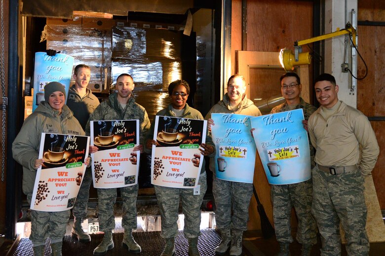 Malmstrom chaplains and chaplain assistants pose in front of a donation from a non-profit organization Jan. 16, 2018, at Malmstrom Air Force Base, Mont.