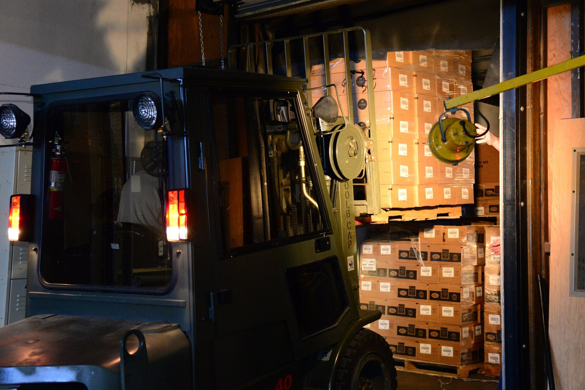 An Airman with the 341st Logistic Readiness Squadron Traffic Management Office unloads a delivery of 400,000 single-serve cups for the base chapel Jan. 16, 2018, at Malmstrom Air Force Base, Mont.