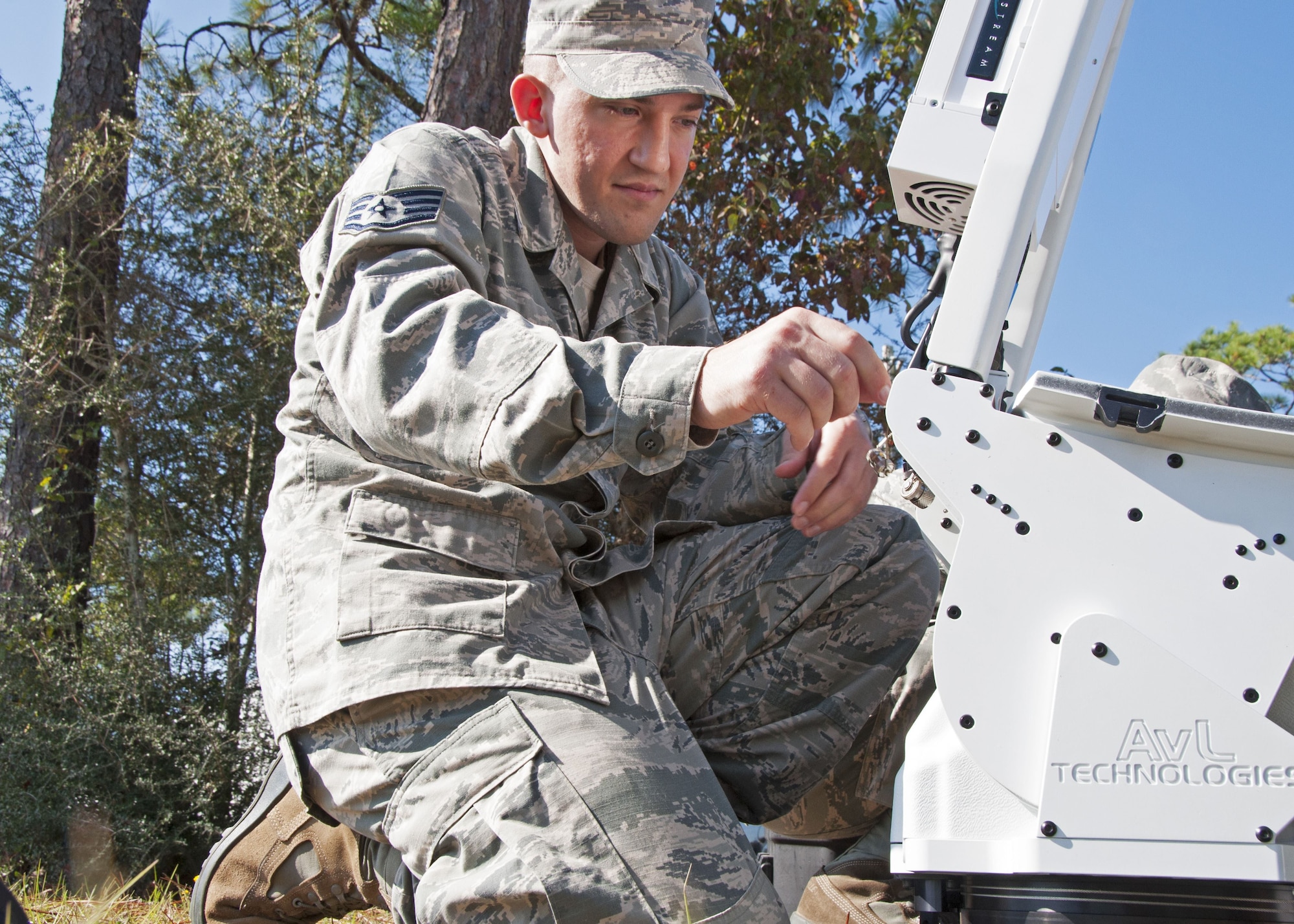Staff Sgt. Frank Poli, a 919th Special Operations Communications Squadron cyber transmissions technician, assembles a satellite communications