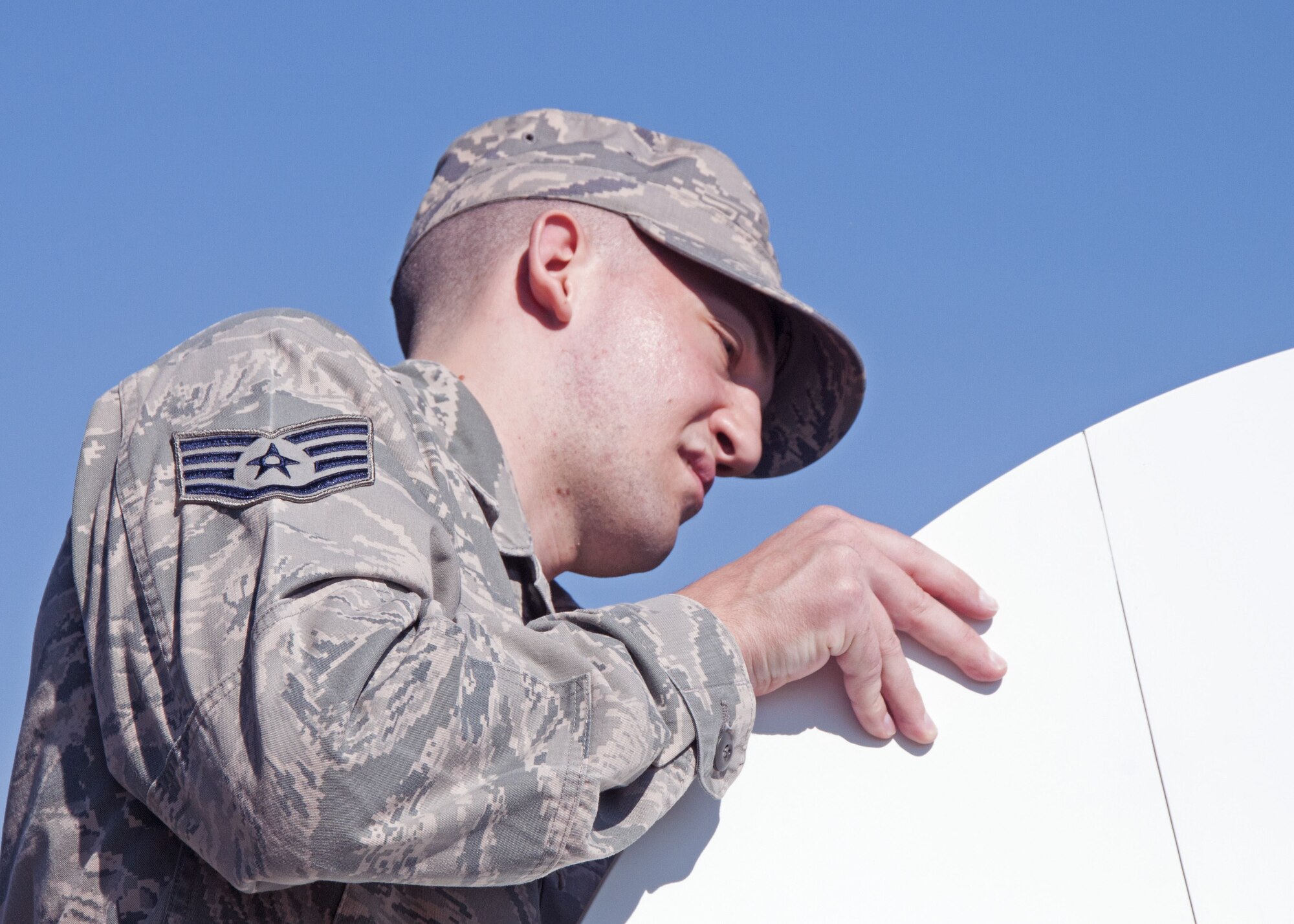 Staff Sgt. Frank Poli, a 919th Special Operations Communications Squadron cyber transmissions technician, assembles a dish