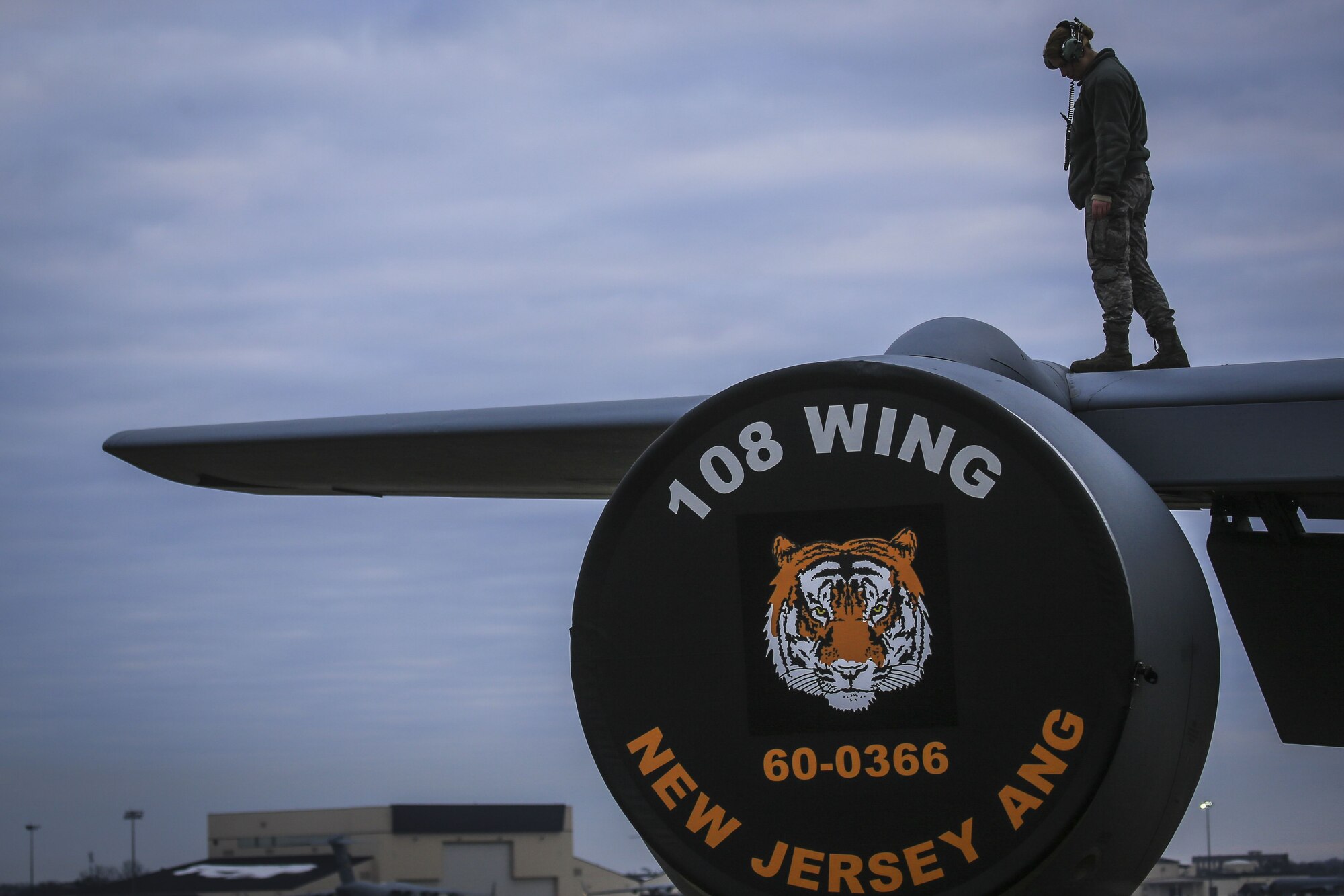 A New Jersey Air National Guard KC-135R Stratotanker crew chief from the 108th Wing checks the wings for imperfections before a flight on Joint Base McGuire-Dix-Lakehurst, N.J., Jan. 11, 2018. (U.S. Air National Guard photo by Master Sgt. Matt Hecht)