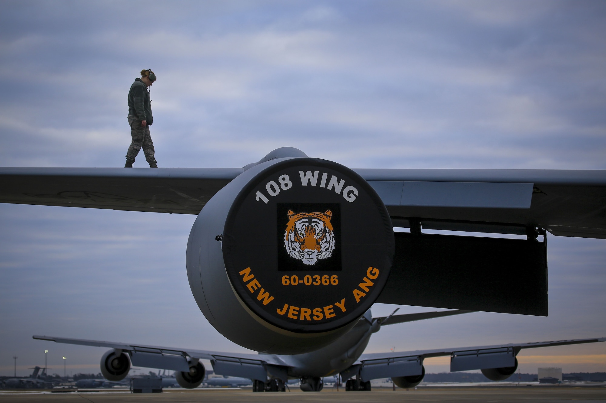 A New Jersey Air National Guard KC-135R Stratotanker crew chief from the 108th Wing checks the wings for imperfections before a flight on Joint Base McGuire-Dix-Lakehurst, N.J., Jan. 11, 2018. (U.S. Air National Guard photo by Master Sgt. Matt Hecht)