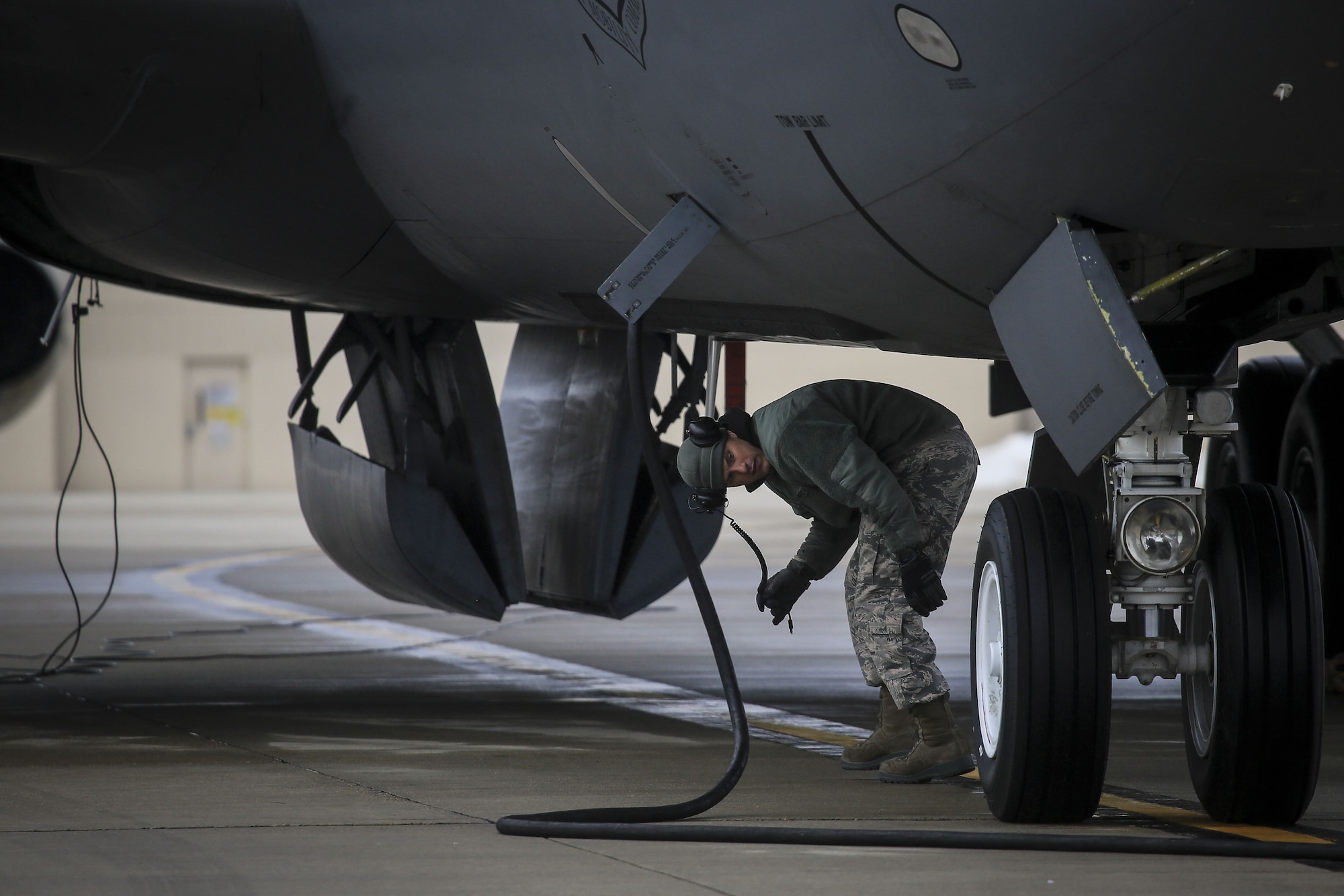 New Jersey Air National Guard Staff Sgt. Robert Cento does pre-flight checks on a 108th Wing KC-135R Stratotanker prior to a training flight on Joint Base McGuire-Dix-Lakehurst, N.J., Jan. 11, 2018. (U.S. Air National Guard photo by Master Sgt. Matt Hecht)