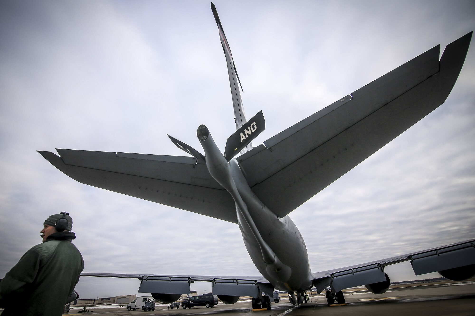 New Jersey Air National Guard Staff Sgt. Robert Cento does pre-flight checks on a 108th Wing KC-135R Stratotanker prior to a training flight on Joint Base McGuire-Dix-Lakehurst, N.J., Jan. 11, 2018. (U.S. Air National Guard photo by Master Sgt. Matt Hecht)