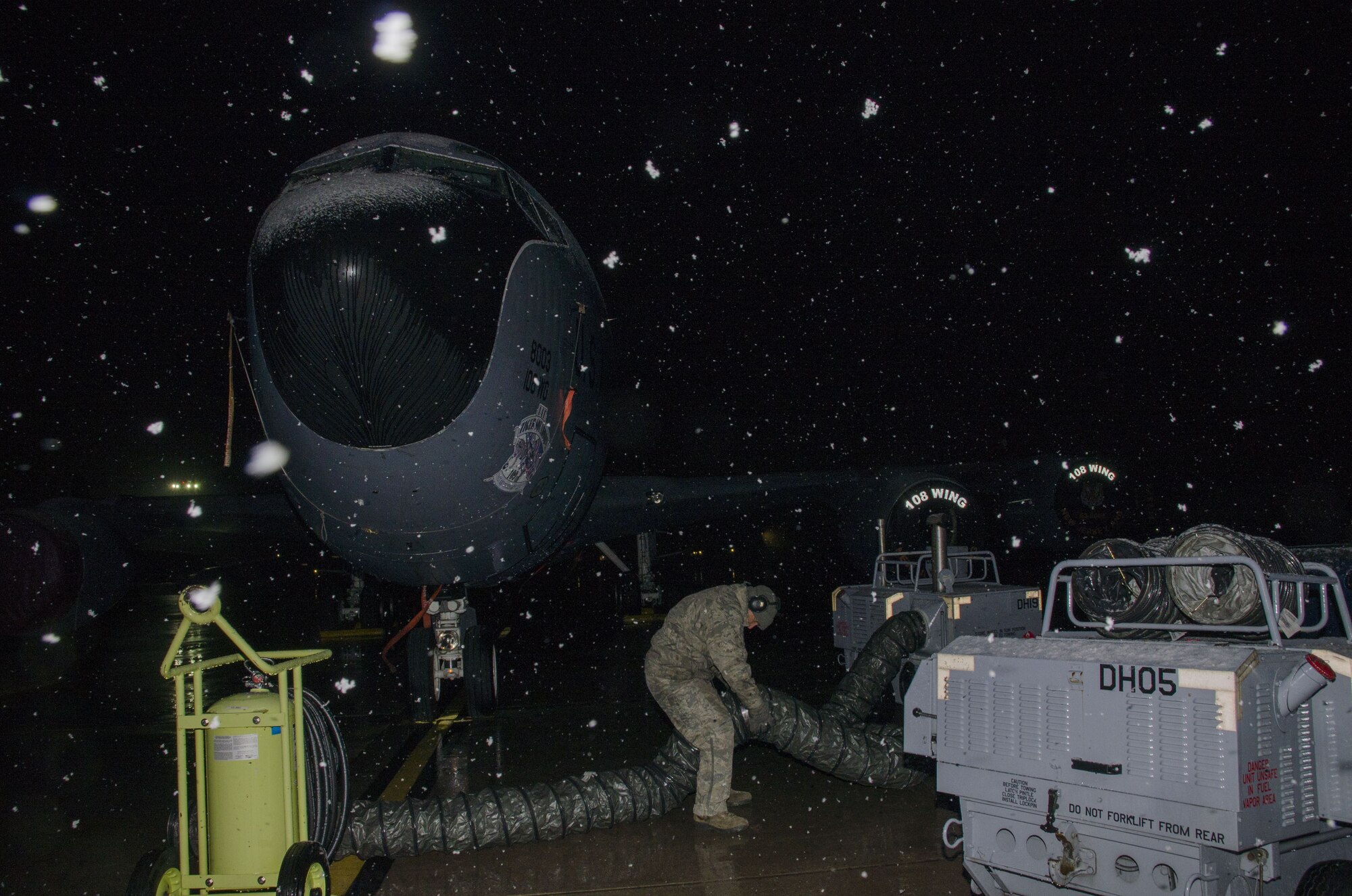 Snow falls as Master Sgt. Frank Diliberto, 108th KC-135R crew chief prepares a jet for the days flight at Joint Base McGuire-Dix-Lakehurst, N.J., Jan. 17, 2018. (U.S. Air National Guard photo by Staff Sgt. Ross A. Whitley)