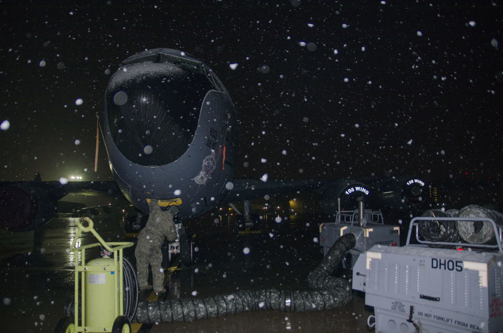 Snow falls as Master Sgt. Frank Diliberto, 108th KC-135R crew chief prepares a jet for the days flight at Joint Base McGuire-Dix-Lakehurst, N.J., Jan. 17, 2018. (U.S. Air National Guard photo by Staff Sgt. Ross A. Whitley)