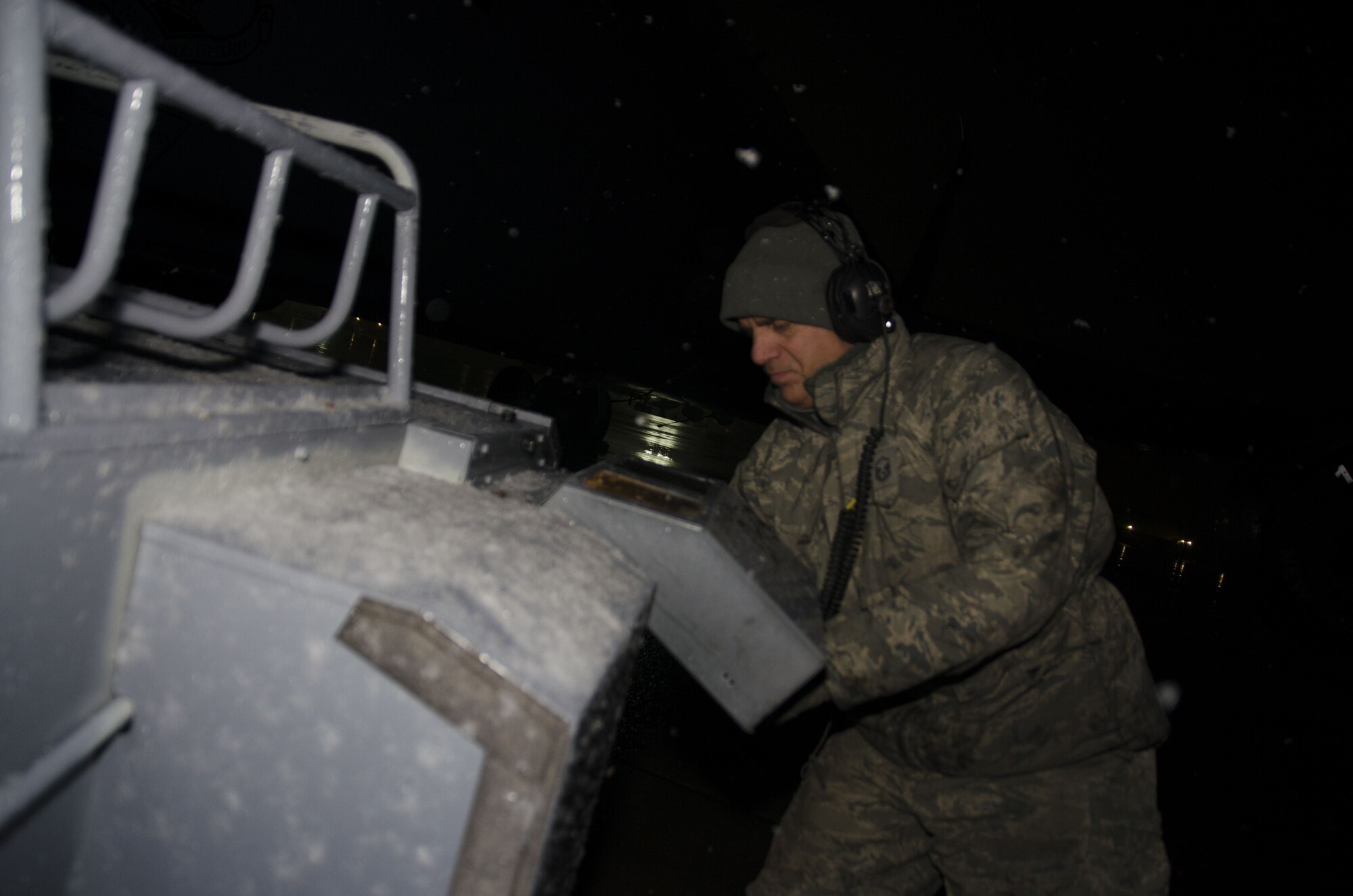 Snow falls as Master Sgt. Frank Diliberto, 108th KC-135R crew chief prepares a jet for the days flight at Joint Base McGuire-Dix-Lakehurst, N.J., Jan. 17, 2018. (U.S. Air National Guard photo by Staff Sgt. Ross A. Whitley)
