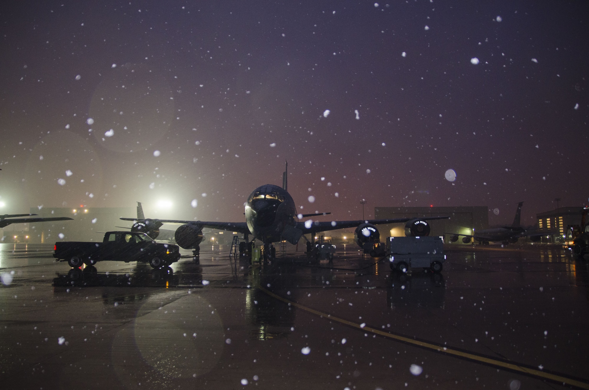 Snow falls as a 141st Air Refueling Squadron KC135R is prepped on the flightline at Joint Base McGuire-Dix-Lakehurst, N.J., Jan. 17, 2018. (U.S. Air National Guard photo by Staff Sgt. Ross A. Whitley)