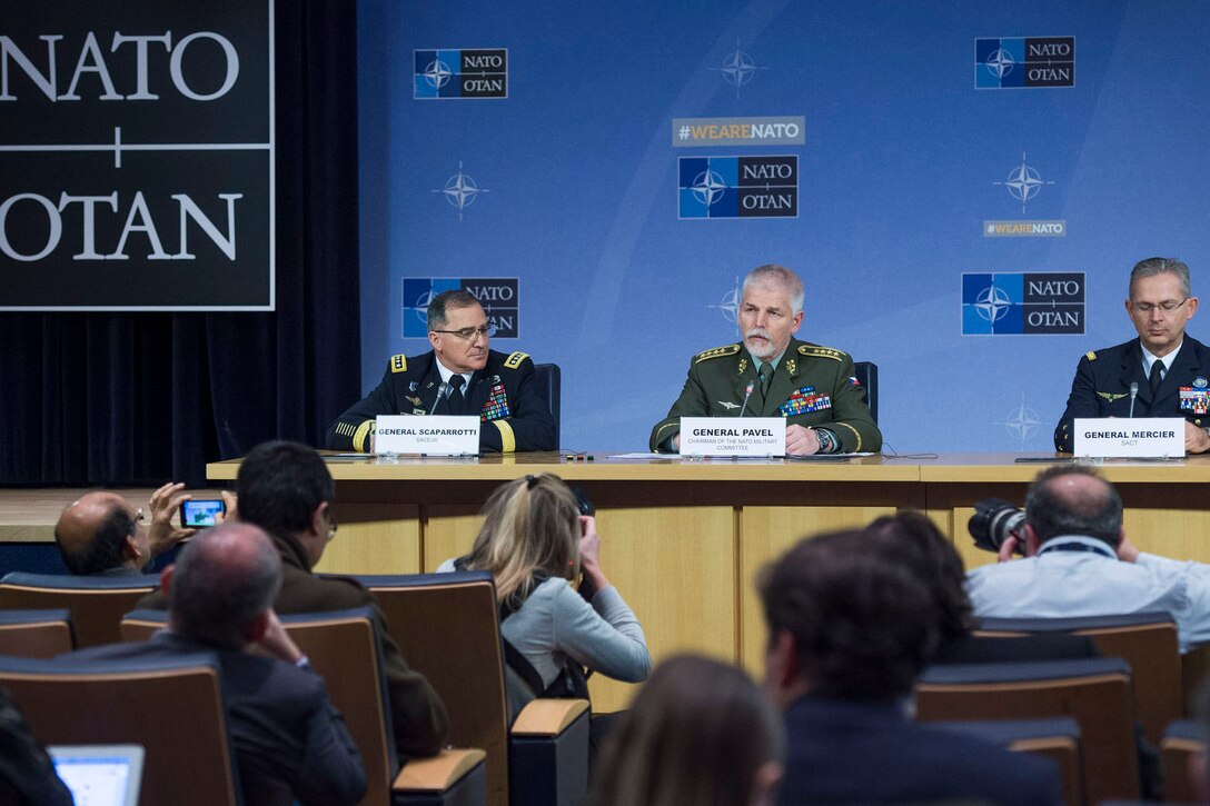 Czech Gen. Petr Pavel, center, the chairman of NATO’s Military Committee, responds to a question during a news conference at NATO headquarters in Brussels after a meeting of the alliance’s Military Committee.