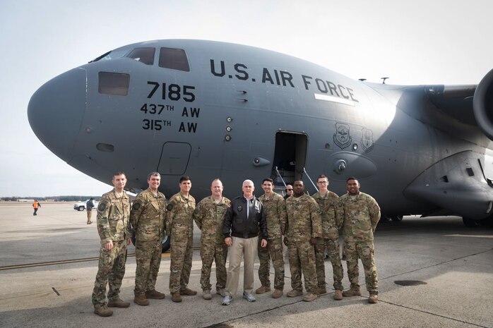 Vice President of the United States Mike Pence poses with, left to right, Air Force Lt. Col. Chris Yengo, 437th Operations Support Squadron, Maj. Jeff Dupuis, 14th Airlift Squadron, Capt. Jordan Nixon, 14th AS, Col. Louis Hansen, 437th Operations Group commander, 1st Lt. Pat Lobo, 14th AS, Tech. Sgt. Cliff Hudson, 14th AS, Airman 1st Class Tom Gauthier, 14th AS and far right, Tech. Sgt. Will Hunt, 437th Aircraft Maintenance Squadron, at Joint Base Andrews, Md., Dec. 22, 2018. The Vice President traveled to Bagram Airfield, Afghanistan, onboard an Air Mobility Command C-17 Globemaster III aircraft assigned to the 437th Airlift Wing, Joint Base Charleston, S.C., to visit U.S. service members and speak on the strategy in Afghanistan. Following a 40-minute speech, Pence thanked troops for their continued service during the holiday season.