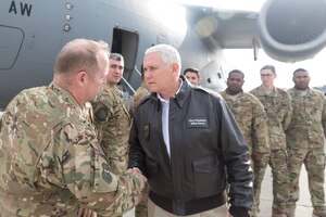 Vice President of the United States Mike Pence greets Air Force Col. Louis Hansen, 437th Operations Group commander with, left to right, Maj. Jeff Dupuis, 1st Lt. Pat Lobo, Tech. Sgt. Cliff Hudson, Airman 1st Class Tom Gauthier, all assigned to the 14th Airlift Squadron and Tech. Sgt. Will Hunt, far right, 437th Aircraft Maintenance Squadron at Joint Base Andrews, Md. Dec. 22, 2018. The Vice President traveled to Bagram Airfield, Afghanistan, onboard an Air Mobility Command C-17 Globemaster III aircraft assigned to the 437th Airlift Wing, Joint Base Charleston, S.C., to visit U.S. service members and speak on the strategy in Afghanistan. Following a 40-minute speech, Pence thanked troops for their continued service during the holiday season.